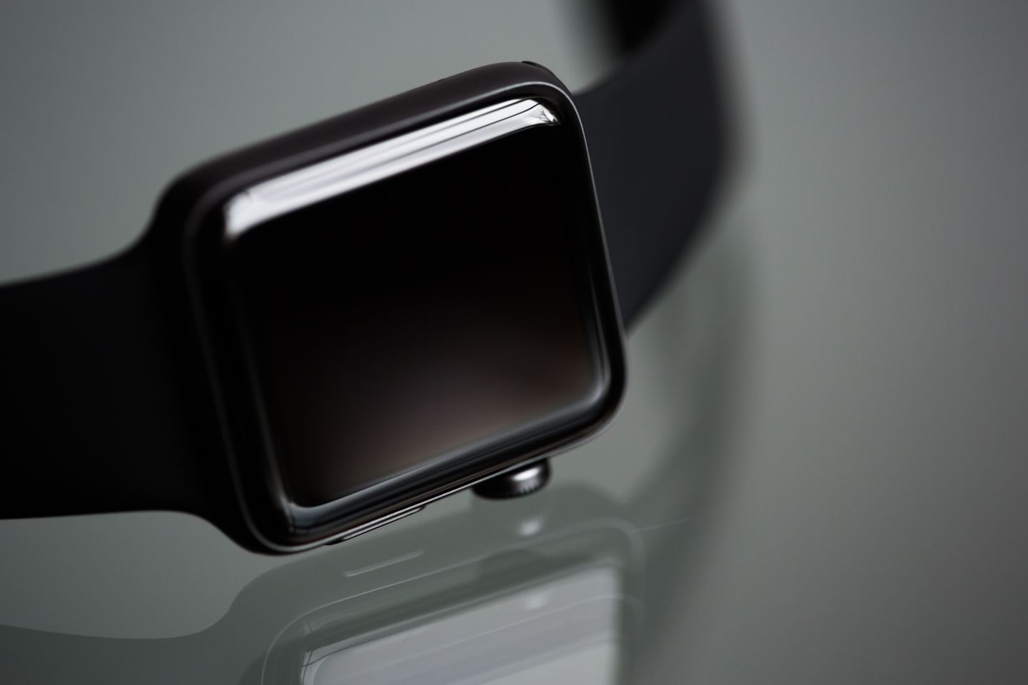 Photograph: Detailed close-up of a stylish modern smartwatch with a black band, ideal for tech enthusiasts.